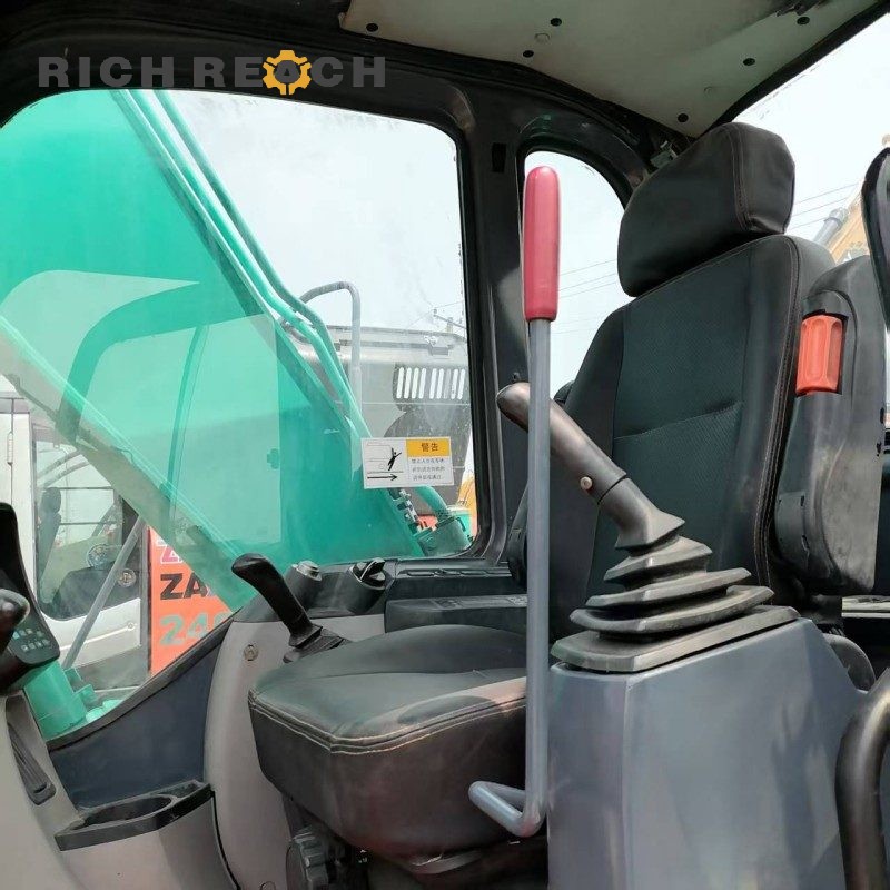 Cab interior and monitor display of a 2017 Kobelco SK130LC excavator, 500 hours, $20,833